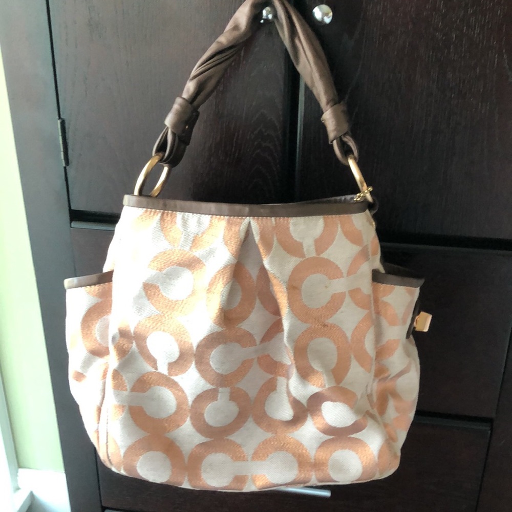 Light pink/ rose gold coach purse